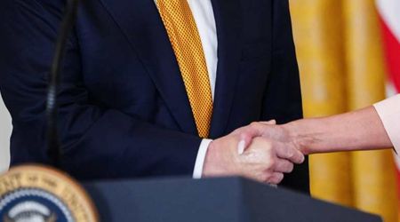 Trump’s swollen hands appear covered in makeup at White House amid growing health concerns