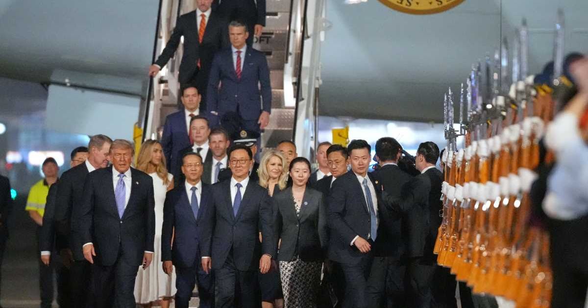 President Donald Trump walks with Chinese Vice President Han Zheng during a welcome ceremony at Beijing Capital International Airport in Beijing on May 13, 2026 (AP Photo/Mark Schiefelbein)