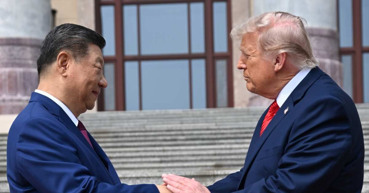 Chinese President Xi Jinping shakes hands with President Donald Trump at the Great Hall of the People in Beijing, Thursday, May 14, 2026 (Kenny Holston/Pool Photo via AP)