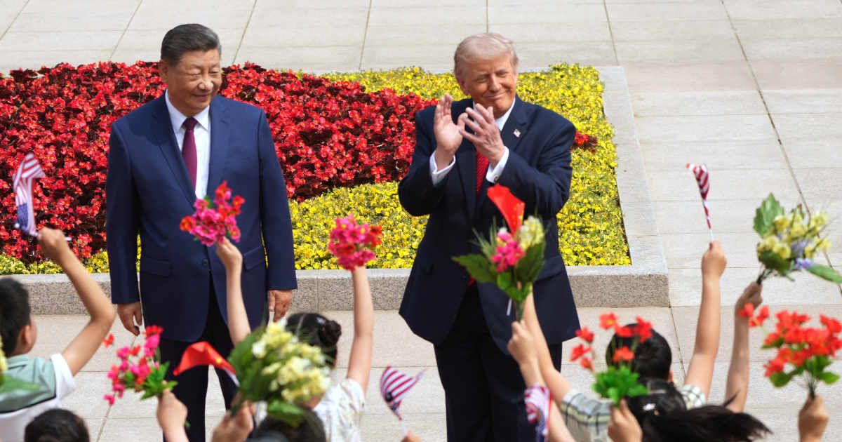 President Donald Trump and China's President Xi Jinping greet children during a welcome ceremony at the Great Hall of the People, Thursday, May 14, 2026, in Beijing (AP Photo/Mark Schiefelbein)