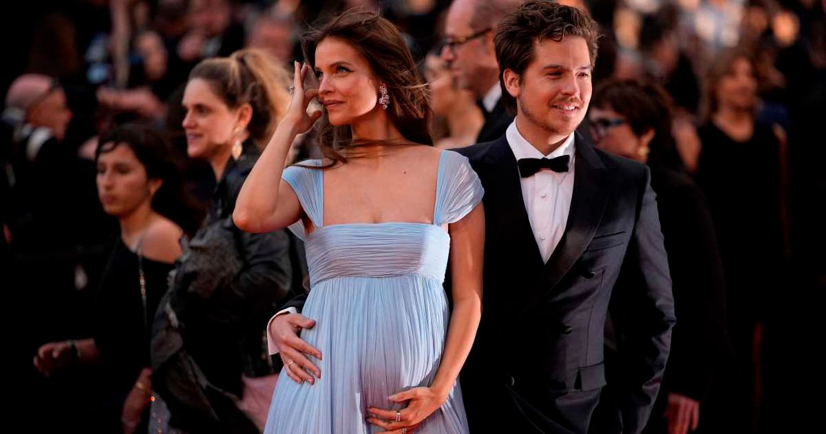 Barbara Palvin debuted her baby bump as she arrived with Dylan Sprouse at the premiere of 'Parallel Tales' during the Cannes Film Festival in France on May 14, 2026 (AP Photo/John Locher)