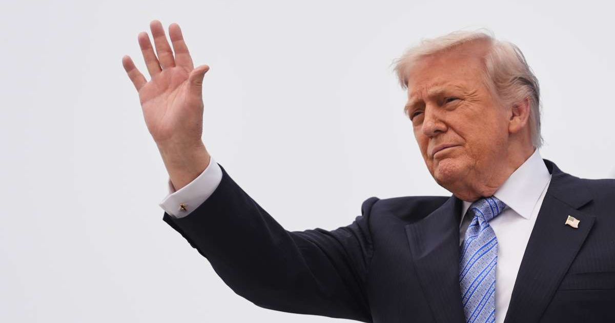 Trump waves while boarding Air Force One at Beijing Capital International Airport in Beijing on Friday, May 15, 2026 (AP Photo/Mark Schiefelbein)