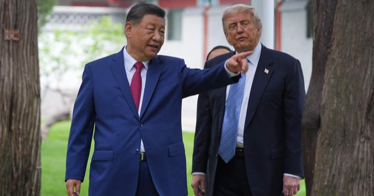 President Donald Trump talks with Chinese President Xi Jinping at the Zhongnanhai leadership compound, Friday, May 15, 2026, in Beijing (AP Photo/Mark Schiefelbein, Pool)