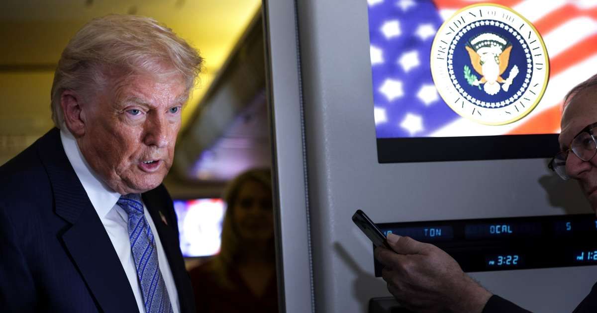 President Donald Trump speaks to the media aboard Air Force One on May 15, 2026, as he returns to the United States (Getty Images)