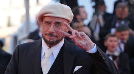 John Travolta's wool beret look at Cannes 2026 draws attention as he receives honorary Palme d’Or