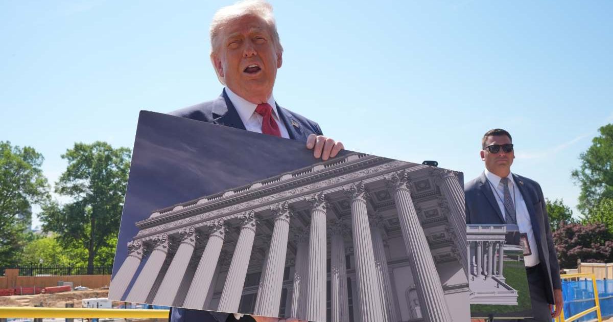 President Donald Trump sparked a conversation about his appearance after vehemently insisting before hiding his waist behind a huge photo (AP Photo/Jacquelyn Martin)