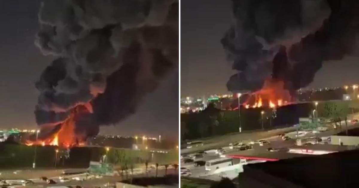 Viral video claims to show building on fire in Iran following strikes by United States (@WarUpdates/X)