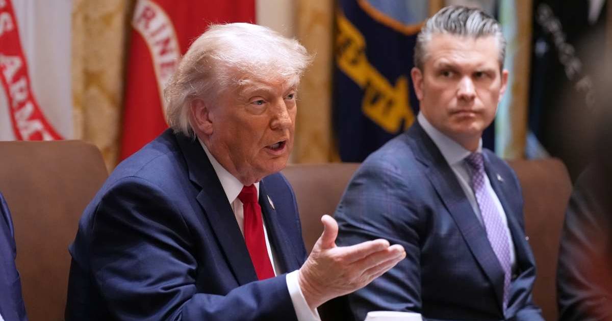 President Donald Trump speaks during a Cabinet meeting at the White House, Wednesday, May 27, 2026, in Washington, as Secretary of Defense Pete Hegseth, looks on (AP Photo/Jacquelyn Martin)