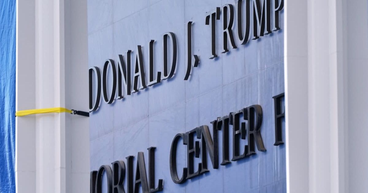 Workers install Donald J Trump above the current signage on the Kennedy Center on Friday, December 19, 2025, in Washington (AP Photo/Jacquelyn Martin)