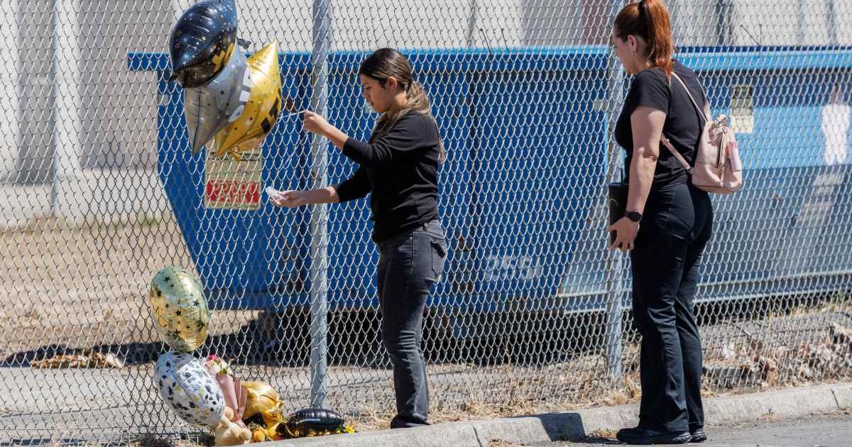 People drop off balloons outside Schaefer Stadium at Fairfield High School in Fairfield, Calif., on Thursday, June 4, 2026, after a shooting on Wednesday (Santiago Mejia/San Francisco Chronicle via AP)