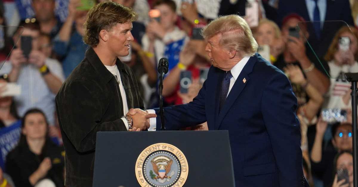 Speaking to reporters at the White House, President Donald Trump recalled a conversation with Jaxson Dart, whom he described as a 'big, strong guy' (AP Photo/Ryan Murphy)