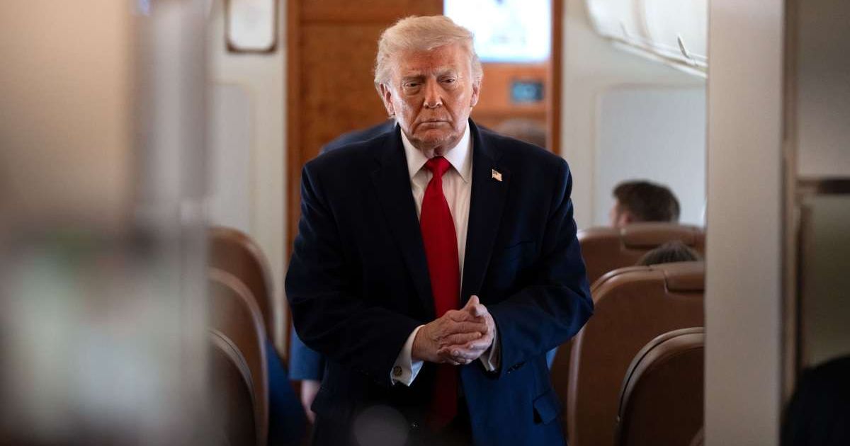Social media rumors claim President Donald Trump posted an image of himself dressed as a footballer surrounded by male cheerleaders (AP Photo/Mark Schiefelbein)
