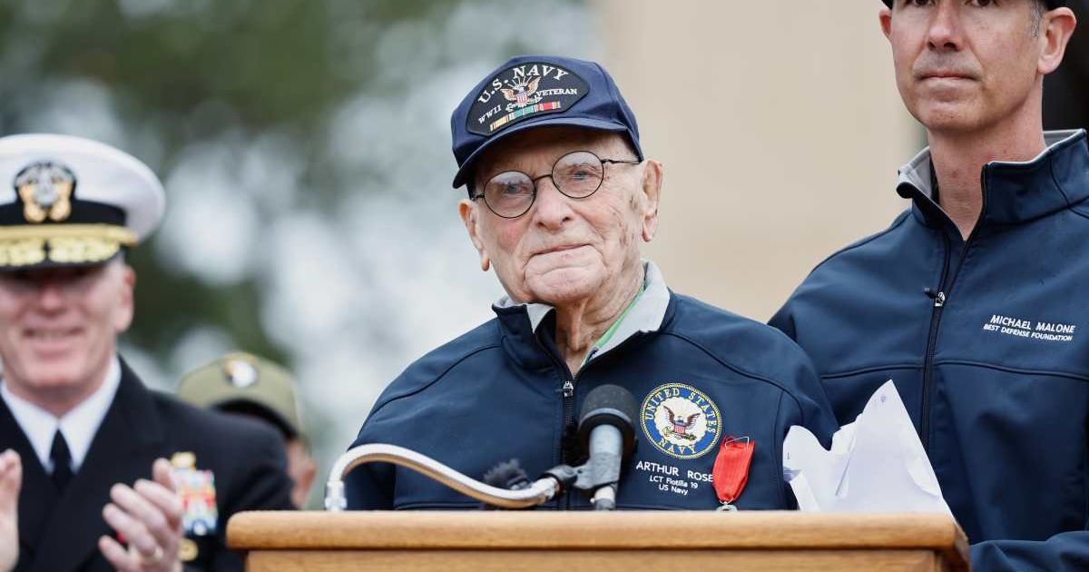 World War II veteran Arthur Rose read from a letter during a ceremony in Normandy (AP Photo/Jeremias Gonzalez)