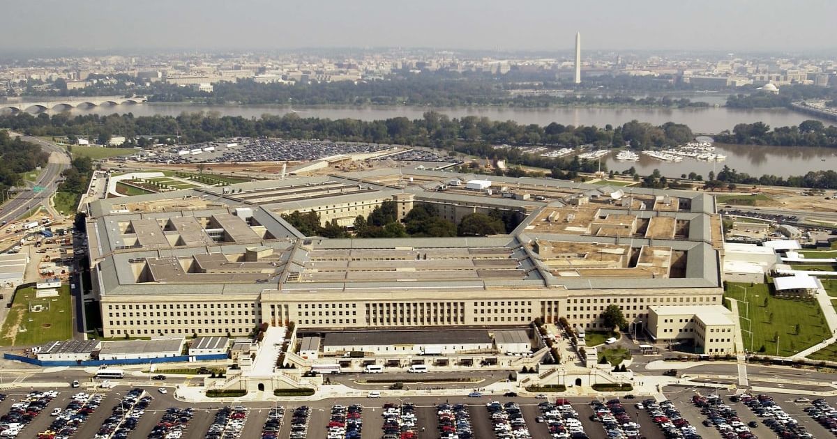 Security personnel and staff were seen outside the Pentagon during the temporary lockdown in Arlington (Getty Images)