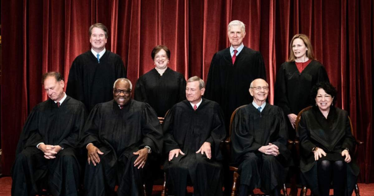 Members of the Supreme Court pose for a group photo at the Supreme Court in Washington, DC on April 23, 2021 (Getty Images)