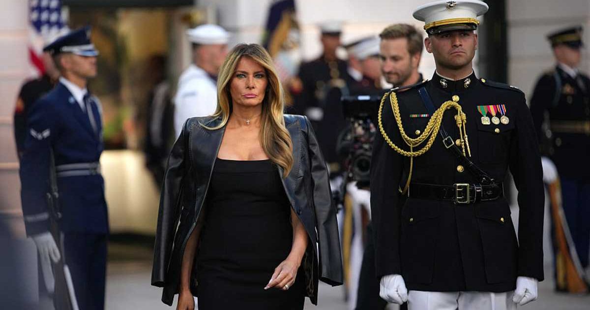 First Lady Melania Trump arrived with a military escort in a black Dolce & Gabbana ensemble for UFC Freedom 250 (Getty Images)