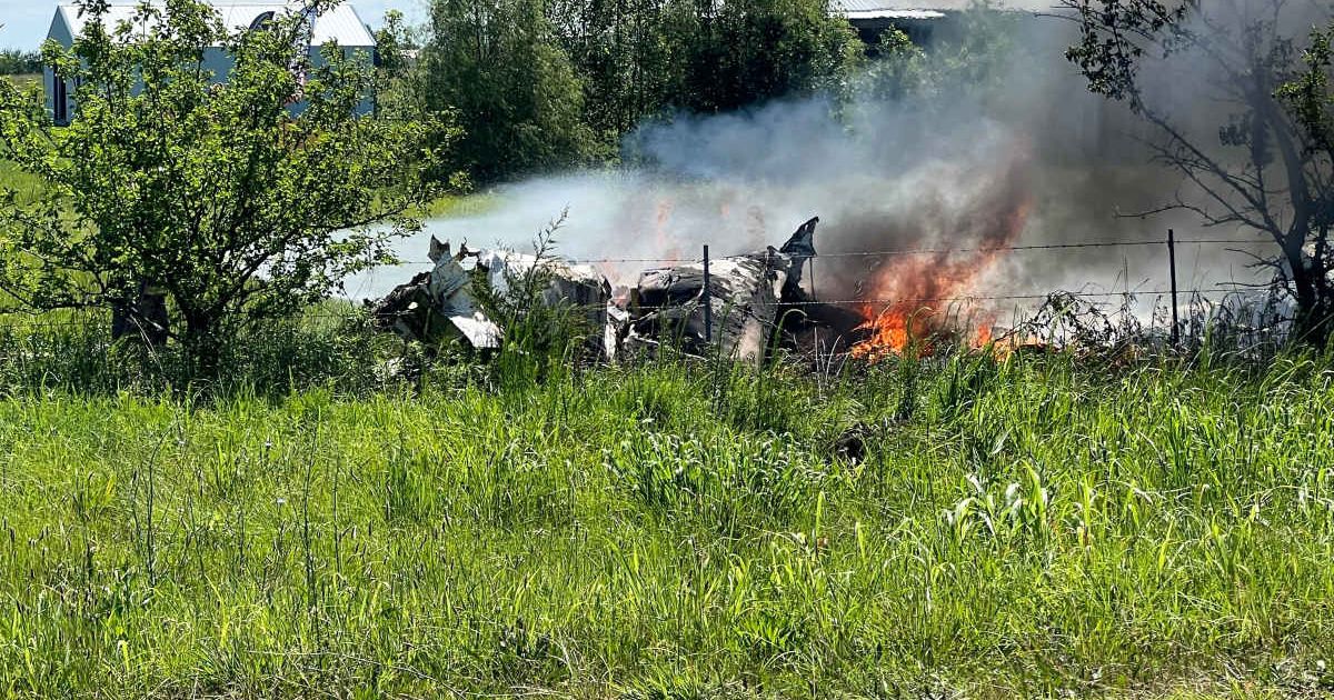 The wreckage of a plane crash burns in a field in Butler, Mo, Sunday, June 14, 2026 (Mid America News Review via AP Photo )