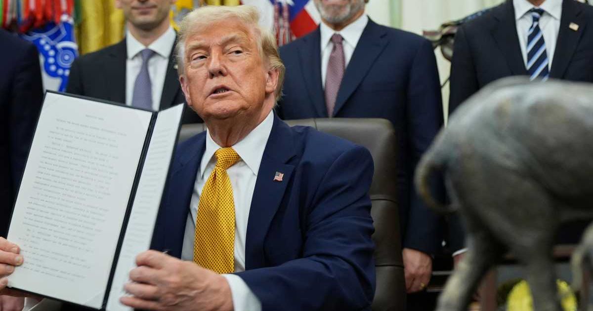 President Donald Trump held a signing ceremony in the Oval Office as federal policy decisions were announced in Washington, DC (AP Photo/Jacquelyn Martin)