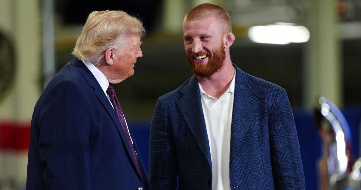 President Donald Trump speaks with Bo Nickal, a UFC middleweight fighter, on stage at a Mack Trucks facility, Tuesday, June 23, 2026, in Macungie, Pa. (AP Photo/Julia Demaree Nikhinson)