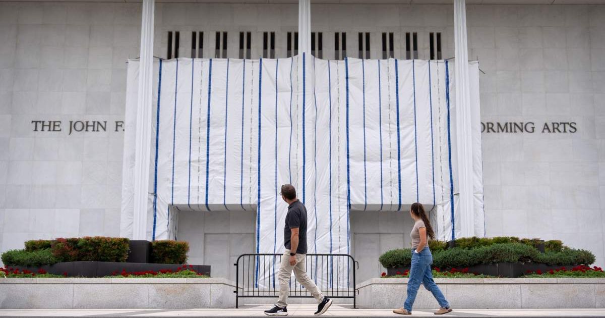 A federal judge has ordered the Trump administration to explain the purpose of the tarp and scaffolding covering part of the Kennedy Center's facade as a legal dispute over changes to the venue continues (AP Photo/Mark Schiefelbein)