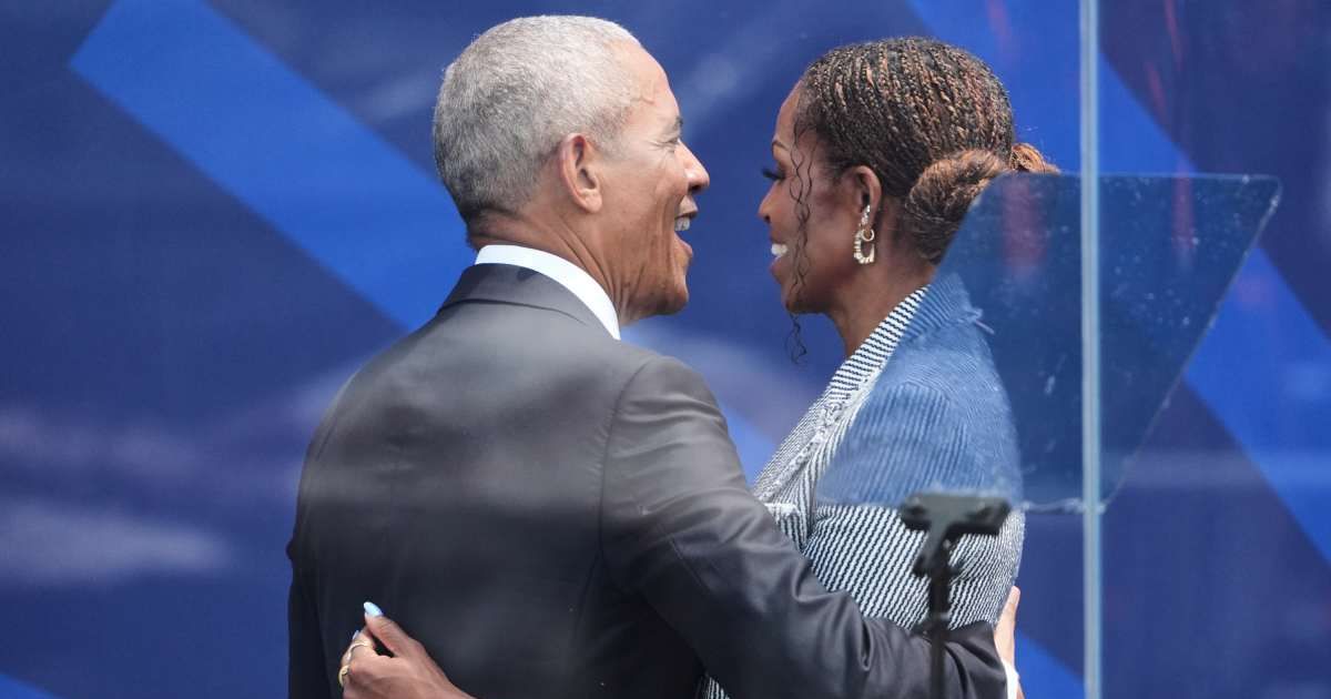 Former President Barack Obama embraced former first lady Michelle Obama after her speech at the Obama Presidential Center dedication ceremony in Chicago (AP Photo/Jeff Roberson)