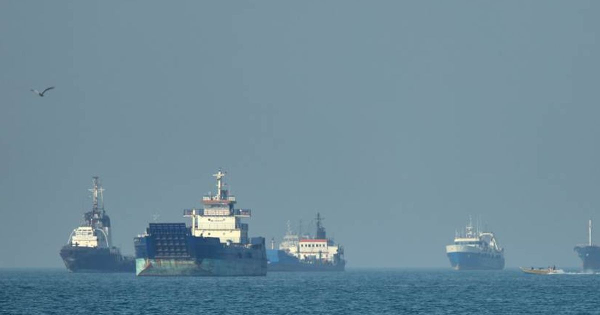 A cargo ship was struck by a projectile in the Strait of Hormuz, with reports later pointing to possible Iranian involvement (Amirhosein Khorgooi/ISNA via AP)