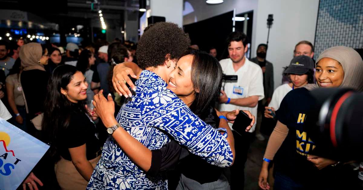 Democratic congressional candidate Melat Kiros celebrates with a supporter at an election-night watch party after winning the Colorado primary on June 30, 2026 in Denver, Colorado (Getty Images)