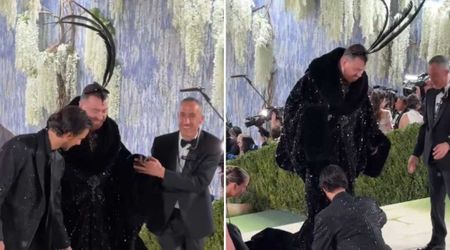 Fact Check: Does a viral video show Travis Kelce walking into his wedding in a sequined outfit?