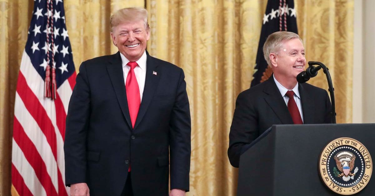 President Donald Trump looks on as Sen Lindsey Graham (R-SC) speaks during an event about judicial confirmations in the East Room of the White House on November 6, 2019 in Washington, DC (Getty Images)