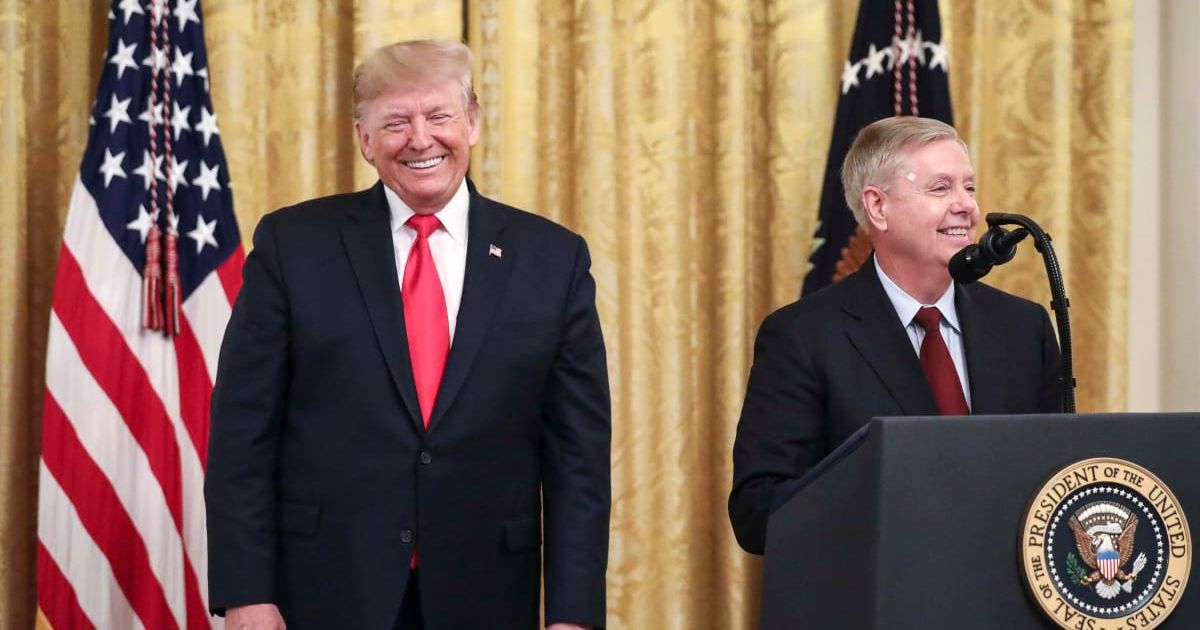 President Donald Trump looks on as Sen Lindsey Graham speaks during an event in the East Room of the White House on November 6, 2019, in Washington, DC (Getty Images)
