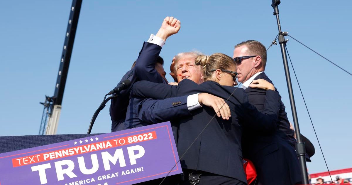 Donald Trump is rushed offstage during a rally on July 13, 2024 in Butler, Pennsylvania, where a bullet grazed his upper right ear during an assassination attempt (Getty Images) 