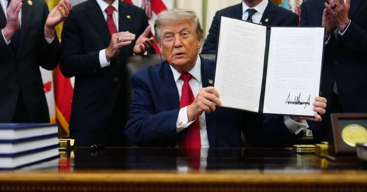 President Donald Trump holds an executive order modifying the Bears Ears National Monument in the Oval Office of the White House, Monday, July 13, 2026 (AP Photo/Julia Demaree Nikhinson)