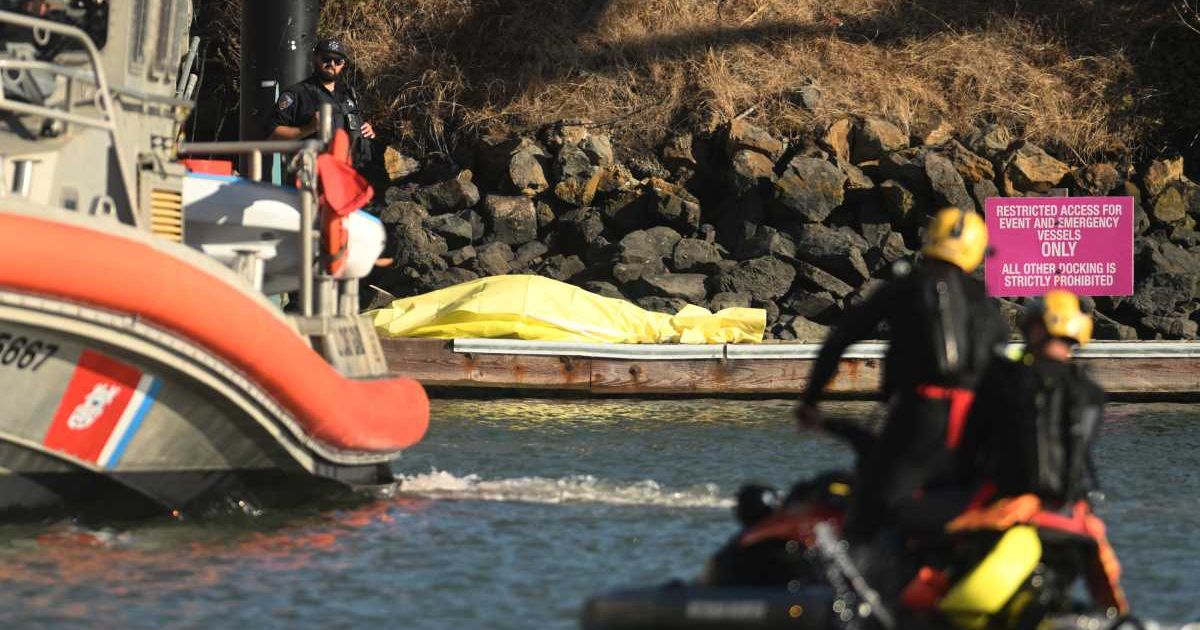 The boat was found nearly submerged as rescuers searched for missing passengers. Officials are investigating the cause, and the search remains ongoing (AP Photo/Noah Berger)