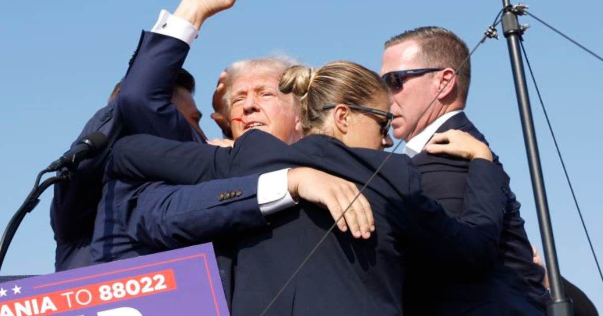 Donald Trump pumps his fist as he is rushed offstage during a rally on July 13, 2024 in Butler, Pennsylvania (Anna Moneymaker/Getty Images)