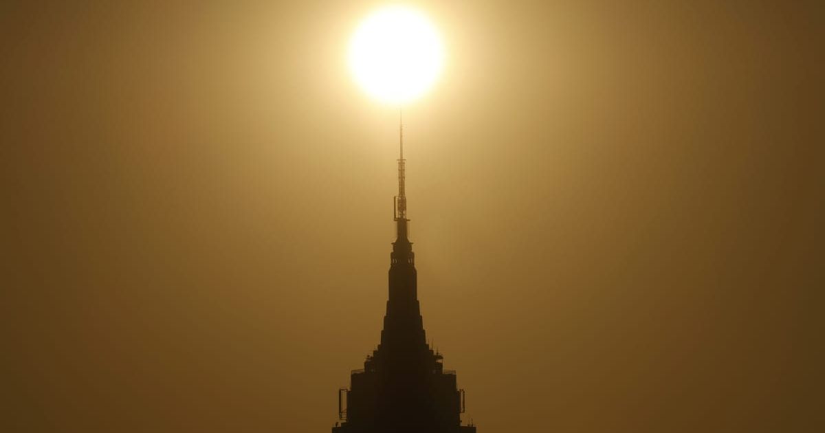 Boston's sky glows an eerie yellow as residents question smoky haze dimming the sun
