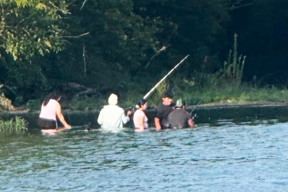 In this photo provided by Pastor Marcus L. Martin, a group of people he believes were those who died in a recent drowning accident, are shown fishing along the Scioto river in Powell, Ohio, Sunday, July 19, 2026