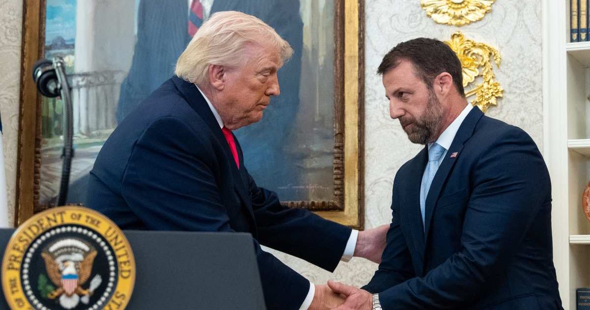 President Donald Trump shakes hands with Homeland Security Secretary Markwayne Mullin during his swearing-in in the Oval Office of the White House, Tuesday, March 24, 2026, in Washington (AP Photo/Alex Brandon)