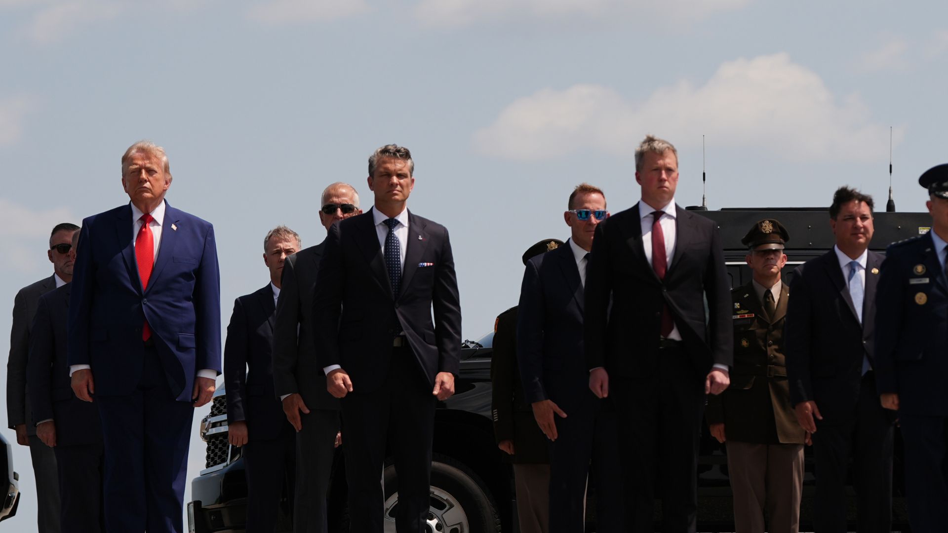 President Donald Trump, left, and Defense Secretary Pete Hegseth, second left, attend a dignified transfer Wednesday, July 22, 2026, at Dover Air Force Base, Del. (AP Photo/Julia Demaree Nikhinson)