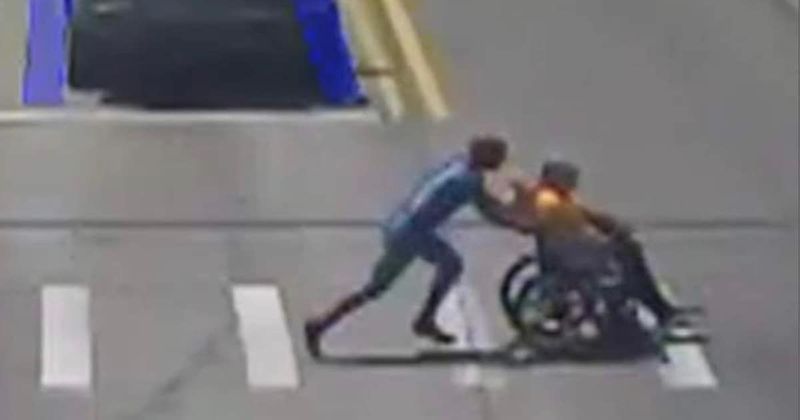 Watch: Man dressed as Spider-Man sprints across road to help stranded wheelchair user