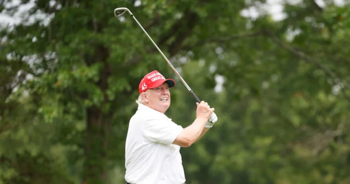 Social media rumors claim that golf organizations are working to ban President Donald Trump from officially playing the sport (Cliff Hawkins/Getty Images)