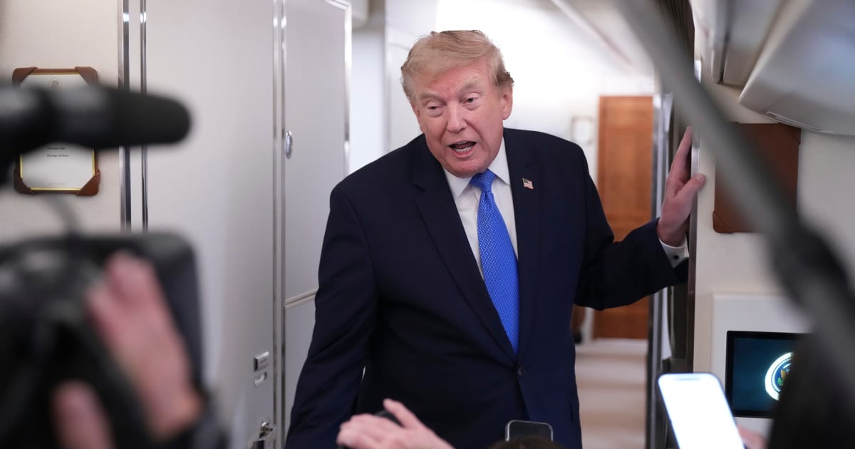 President Donald Trump spoke to reporters aboard Air Force One while returning to the White House on August 2 (AP Photo/Jacquelyn Martin)