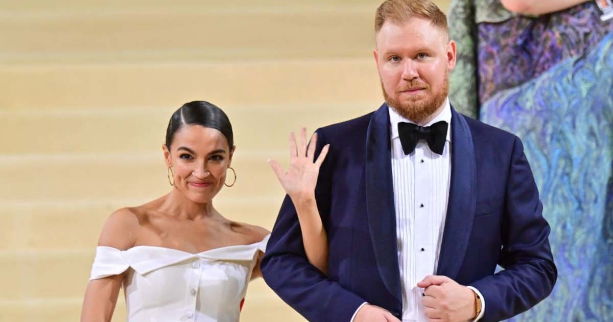 Alexandria Ocasio-Cortez and Riley Roberts leave the 2021 Met Gala Celebrating In America: A Lexicon Of Fashion at Metropolitan Museum of Art on September 13, 2021, in New York City (James Devaney/GC Images)