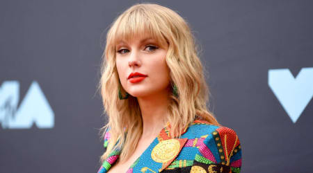 Taylor Swift debuts new hair, shows off massive Travis Kelce wedding ring at Oli Jacobs' wedding