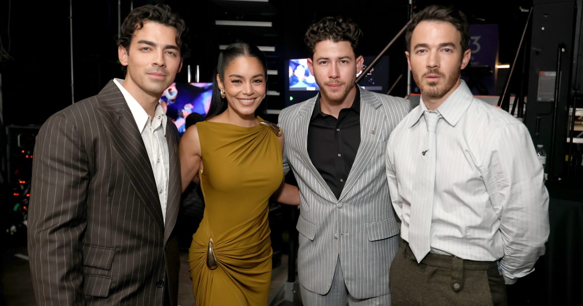 Joe Jonas, Vanessa Hudgens, Nick Jonas, and Kevin Jonas at the Disney Entertainment Showcase at D23: Legends on August 16, 2026, in Anaheim, California (Kevin Mazur/Getty Images for Disney)