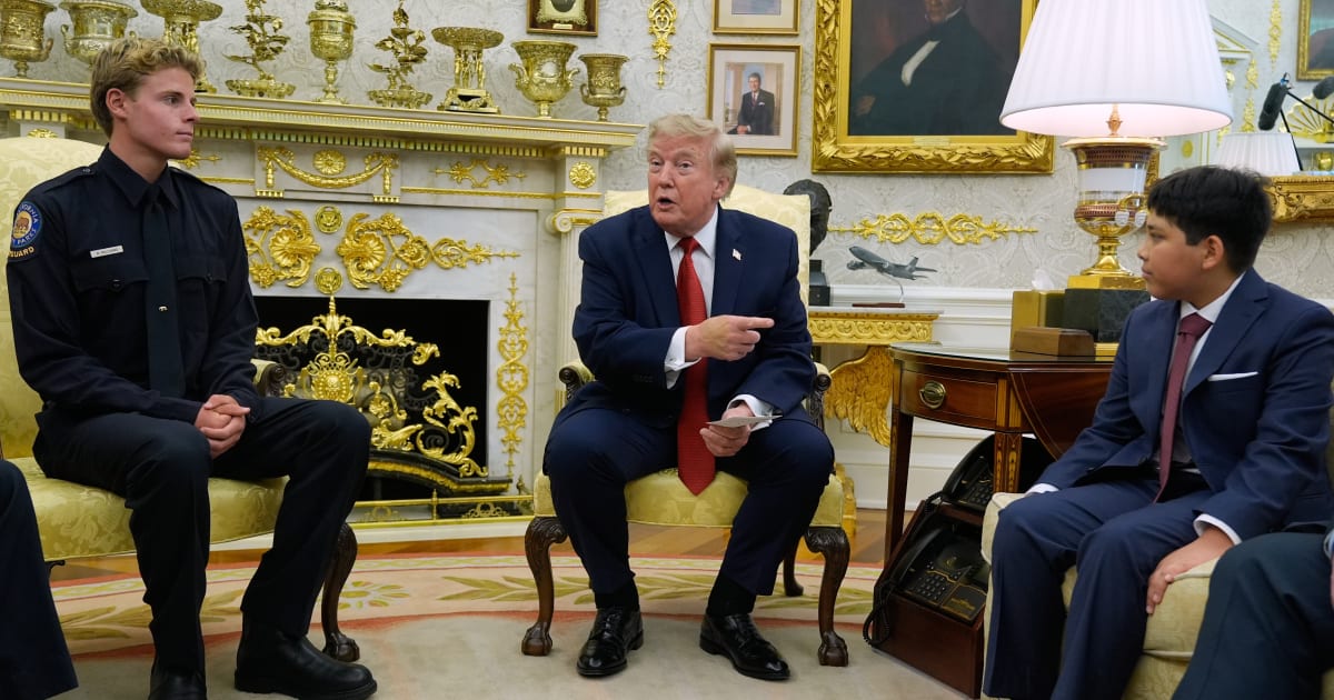 President Donald Trump gestures to Nathaniel Rai, the boy lifeguard Ryder Williams saved, as they meet in the Oval Office of the White House, Monday, Aug. 17, 2026, in Washington (AP Photo/Manuel Balce Ceneta)