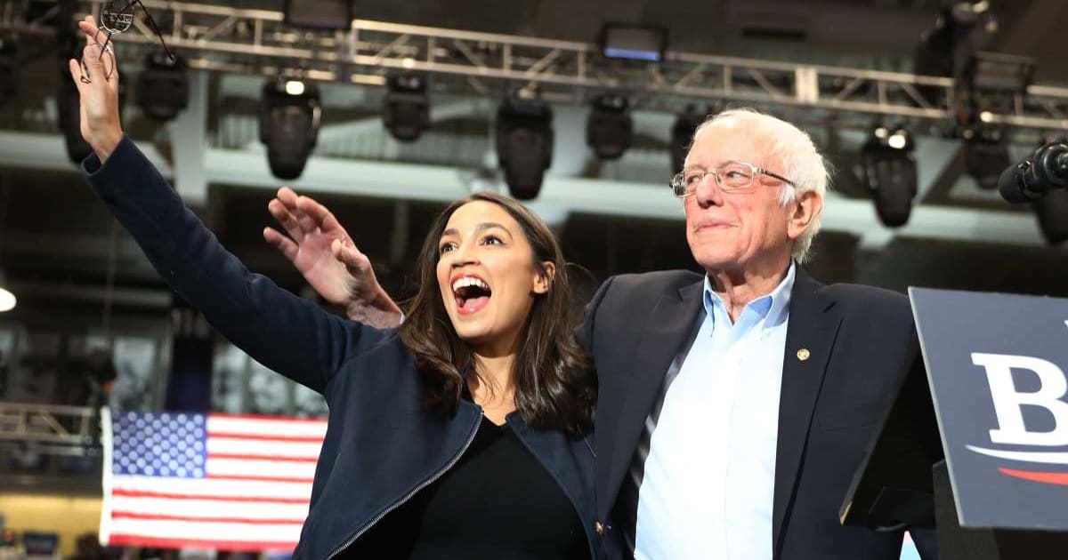 A viral social media post claims Alexandria Ocasio-Cortez and Bernie Sanders are ordered to repay millions of taxpayer funds they spent on the 'No Oligarchs' trip (Getty Images)