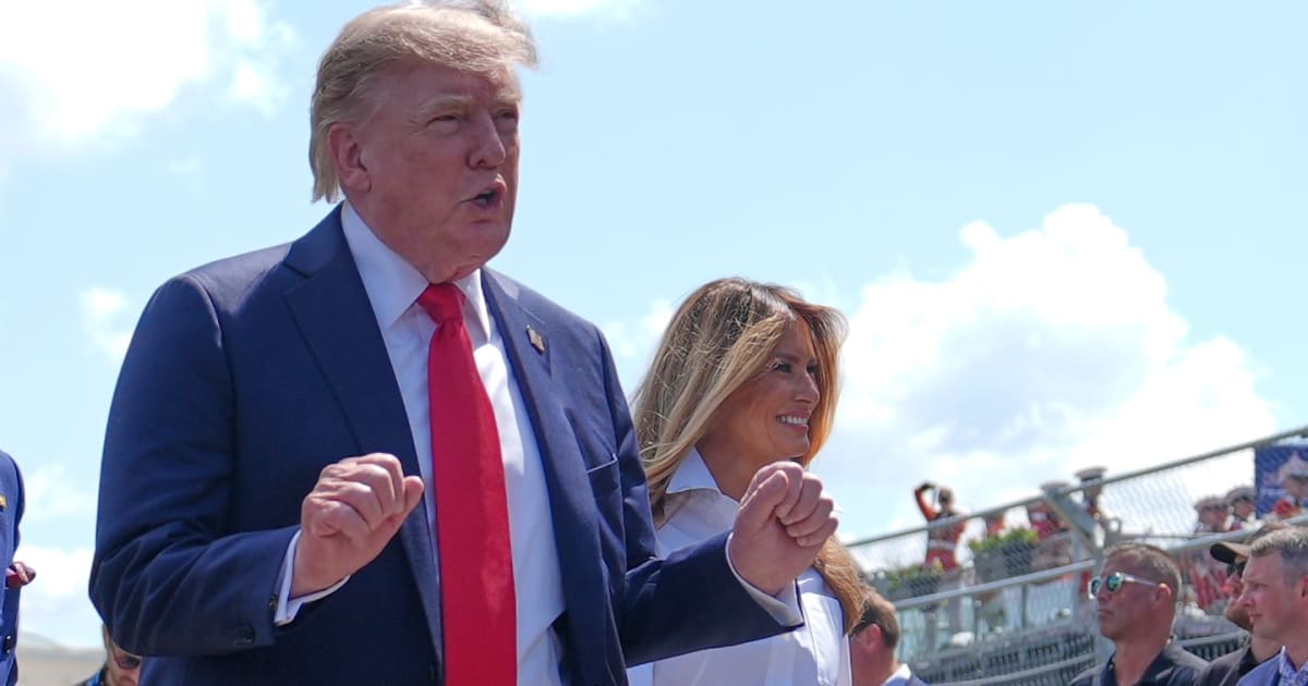 President Donald Trump, left, and first lady Melania Trump attend the IndyCar Freedom 250 Grand Prix auto race, Sunday, Aug. 23, 2026, in Washington. (AP Photo/Julia Demaree Nikhinson)