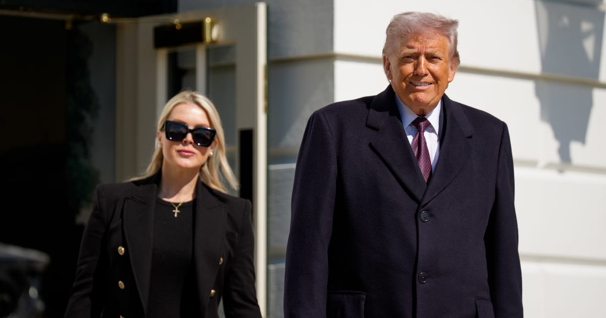 President Donald Trump, accompanied by White House Press Secretary Karoline Leavitt,  walks towards the media as he departs on Marine One on the South Lawn of the White House on February 27, 2026, in Washington, DC (Getty Images)