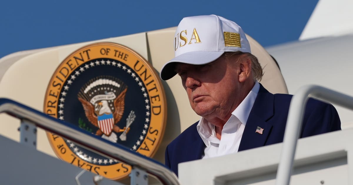 President Donald Trump disembarks Air Force One, Sunday, August 9, 2026, at Joint Base Andrews, Md (AP Photo/Julia Demaree Nikhinson)