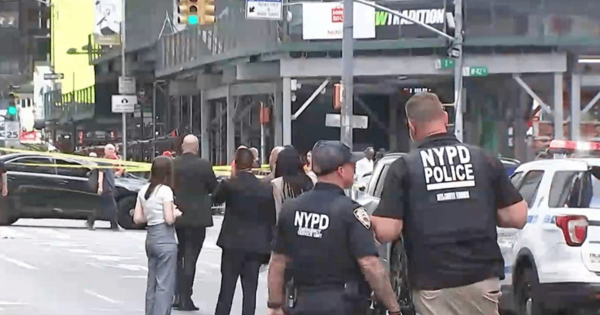 This image, made from video provided by WABC, shows NYPD officers on the scene after a woman brandishing two large knives was shot by officers in Times Square in New York on Monday, August 31, 2026 (WABC via AP)